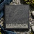 St Sunday Crag topographic slate coaster on grey rock with moss, pebbles and heather