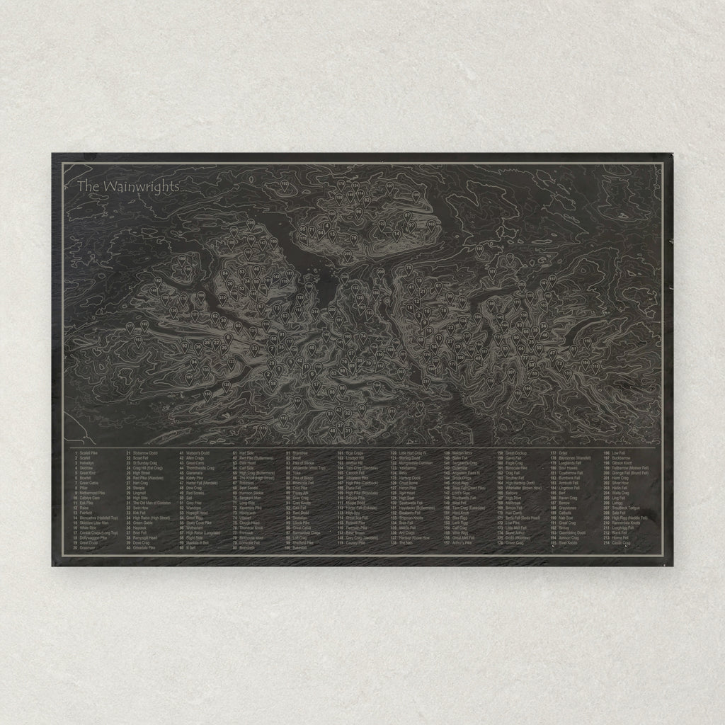 Natural slate placemat engraved with a contour map of the Lake District, all 214 Wainwright fells numbered and listed in a key, titled The Wainwrights